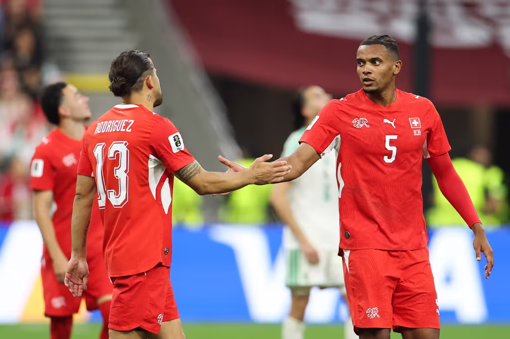 Manuel Akanji and teammates celebrate after a goal against Algeria at the FIFA World Cup
